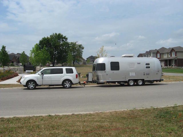 Pilot tows camper