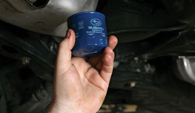 New Subaru Oil Filter Being Changed