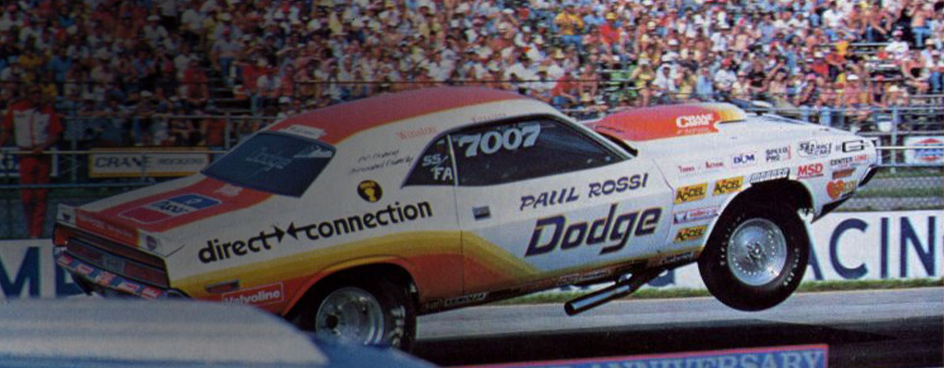 Dodge muscle car popping wheely at track Dodge muscle car popping wheely at track