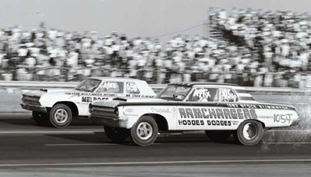 1950s drage race between two dodge vehicles on the track