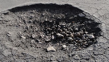 Potholes can cause damage to tires, rims, suspension, and more.