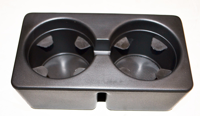 19154712 - Interior: 2007-2014 GM Interior Floor Console Cup Holder for Chevrolet: Avalanche, Silverado 1500, Silverado 1500 Classic, Silverado 1500 HD Classic, Silverado 2500 HD, Silverado 2500 HD Classic, Silverado 3500 Classic, Silverado 3500 HD, Suburban 1500, Suburban 2500, Tahoe | GMC: Sierra 1500, Sierra 1500 Classic, Sierra 1500 HD, Sierra 1500 HD Classic, Sierra 2500, Sierra 2500 HD, Sierra 2500 HD Classic, Sierra 3500, Sierra 3500 Classic, Sierra 3500 HD, Yukon, Yukon XL 1500, Yukon XL 2500 Image