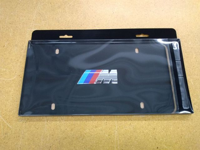 82121470397 - Exterior: Marque Plate - M Logo - Black Stainless Steel for BMW Image
