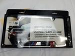 82120010405 - Exterior: M Logo License Plate Frame for BMW: 128i, 135i, 135is, 228i, 228i xDrive, 230i, 230i xDrive, 320i, 320i xDrive, 328d, 328d xDrive, 328i, 328i xDrive, 330e, 330i, 330i GT xDrive, 330i xDrive, 335i, 335i GT xDrive, 335i xDrive, 335is, 340i, 340i GT xDrive, 340i xDrive, 428i, 428i xDrive, 430i, 430i Gran Coupe, 430i xDrive, 435i, 435i xDrive, 440i, 440i xDrive, 528i, 528i xDrive, 530i, 530i xDrive, 535d, 535d xDrive, 535i, 535i GT, 535i GT xDrive, 535i xDrive, 540d xDrive, 540i, 540i xDrive, 550i, 550i GT xDrive, 550i xDrive, 640i, 640i Gran Coupe, 640i xDrive, 640i xDrive Gran Coupe, 640i xDrive Gran Turismo, 650i, 650i Gran Coupe, 650i xDrive, 650i xDrive Gran Coupe, 740e xDrive, 740i, 740i xDrive, 740Li, 740Li xDrive, 750i, 750i xDrive, 750Li, 750Li xDrive, 760Li, 840i, 840i Gran Coupe, Alpina B6 xDrive Gran Coupe, Alpina B7, M2, M235i, M235i xDrive, M240i, M240i xDrive, M3, M340i, M4, M440i Gran Coupe, M5, M550i xDrive, M6, M6 Gran Coupe, M760i xDrive, M8, X1, X2, X3, X4, X5, X6, X7, Z4 Image