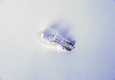 13503360 - Electrical: Backup Lamp Bulb for Buick: Cascada, Enclave, Encore, Envision, Envista, LaCrosse, Regal, Regal Sportback, Regal TourX, Verano | Cadillac: ATS, CT6, CTS, ELR, XT5, XTS | Chevrolet: Blazer, Bolt EUV, Bolt EV, Camaro, Caprice, Colorado, Cruze, Equinox, Malibu, Malibu Limited, Silverado 1500, Silverado 1500 LD, Silverado 1500 LTD, Silverado 2500 HD, Silverado 3500 HD, Sonic, Spark, Spark EV, SS, Suburban, Suburban 3500 HD, Tahoe, Trailblazer, Traverse, Trax | GMC: Acadia, Acadia Limited, Canyon, Sierra 1500, Sierra 1500 Limited, Sierra 2500 HD, Sierra 3500 HD, Terrain, Yukon, Yukon XL Image