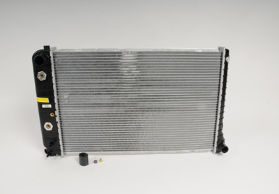 52481615 - Cooling System: Radiator for Buick: Regal | Chevrolet: Caprice, El Camino, Impala, Monte Carlo | GMC: Caballero | Oldsmobile: Cutlass Calais, Cutlass Cruiser, Cutlass Salon, Cutlass Supreme | Pontiac: Bonneville, Grand Prix, Parisienne Image