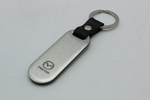 C9N1V0440 - Merchandise: Key Chain, Mazda Logo, Brushed for Mazda: 2, 3, 5, 6, CX-3, CX-30, CX-5, CX-50, CX-7, CX-9, MPV, MX-5 Miata, RX-8, Tribute Image