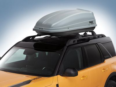 VAT4Z7855100L - Hauling: Thule Rack-Mounted Cargo Box  55 x 26 x 12 for Ford: Bronco, Bronco Sport, C-Max, E-350 Super Duty, E-450 Super Duty, EcoSport, Edge, Escape, Expedition, Explorer, Explorer Sport Trac, F-150, F-250 Super Duty, F-350 Super Duty, F-450 Super Duty, F-550 Super Duty, Fiesta, Flex, Focus, Fusion, Maverick, Mustang Mach-E, Taurus X, Transit Connect | Lincoln: Aviator | Mercury: Mariner, Mountaineer Image