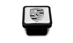 PNA70500300 - : Trailer Hitch Cover - Black Logo on Silver Background for Porsche: Cayenne Image