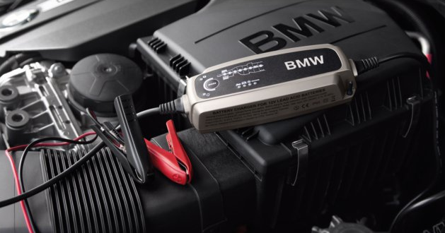 61432408594 - Exterior: Battery Charger for BMW: 228i, 228i xDrive, 230i, 230i xDrive, 320i, 320i xDrive, 328d, 328d xDrive, 328i, 328i xDrive, 330e, 330i, 330i GT xDrive, 330i xDrive, 335i GT xDrive, 335i xDrive, 340i, 340i GT xDrive, 340i xDrive, 428i, 428i xDrive, 430i, 430i xDrive, 435i, 435i xDrive, 440i, 440i xDrive, 528i, 528i xDrive, 530i, 530i xDrive, 535d, 535d xDrive, 535i, 535i xDrive, 540d xDrive, 540i, 540i xDrive, 550i, 550i xDrive, 640i, 640i Gran Coupe, 640i xDrive, 640i xDrive Gran Coupe, 640i xDrive Gran Turismo, 650i, 650i Gran Coupe, 650i xDrive, 650i xDrive Gran Coupe, 740i, 740i xDrive, 740Li, 740Li xDrive, 750i, 750i xDrive, 750Li, 750Li xDrive, 760Li, 840i, Alpina B6 xDrive Gran Coupe, Alpina B7, M2, M235i, M235i xDrive, M240i, M240i xDrive, M3, M340i, M4, M5, M550i xDrive, M6, M6 Gran Coupe, M760i xDrive, M8, X1, X2, X3, X4, X5, X6, X7, Z4 Image