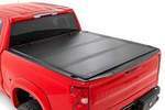 49120650 - : Hard Tri-Fold Flip Up Bed Cover | 6'7" Bed | Fits Chevy/Fits GMC Sierra 1500 (19-25)/Silverado 1500 (19-25) for Rough Country Image