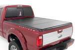 49214651 - : Hard Tri-Fold Flip Up Bed Cover | 6'10" Bed | Ford F-250/F-350 Super Duty (99-16) for Rough Country Image