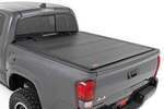 49420500 - : Hard Tri-Fold Flip Up Bed Cover | 5' Bed | Fits Toyota Tacoma 2WD/4WD (2016-2023) for Rough Country Image