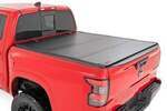 49520551A - : Hard Tri-Fold Flip Up Bed Cover | 5' Bed | Fits Nissan Frontier 2WD/4WD (22-24) for Rough Country Image