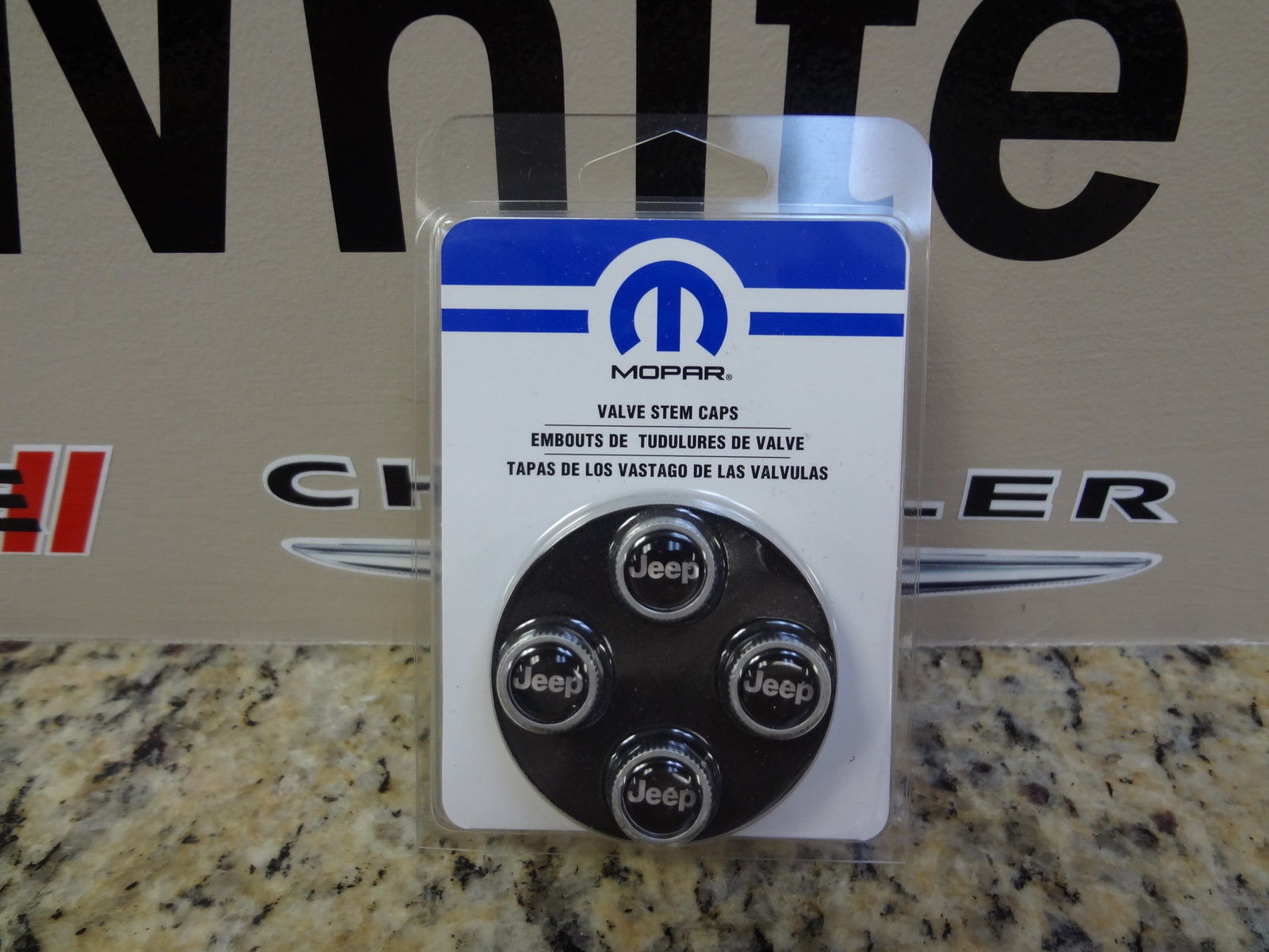 82213628AB - Exterior Accessories: Valve Stem Caps for Jeep: Compass, Gladiator, Grand Cherokee, Grand Cherokee L, Grand Cherokee WK, Grand Wagoneer, Grand Wagoneer L, Liberty, Patriot, Renegade, Wagoneer, Wagoneer L, Wrangler, Wrangler JK Image