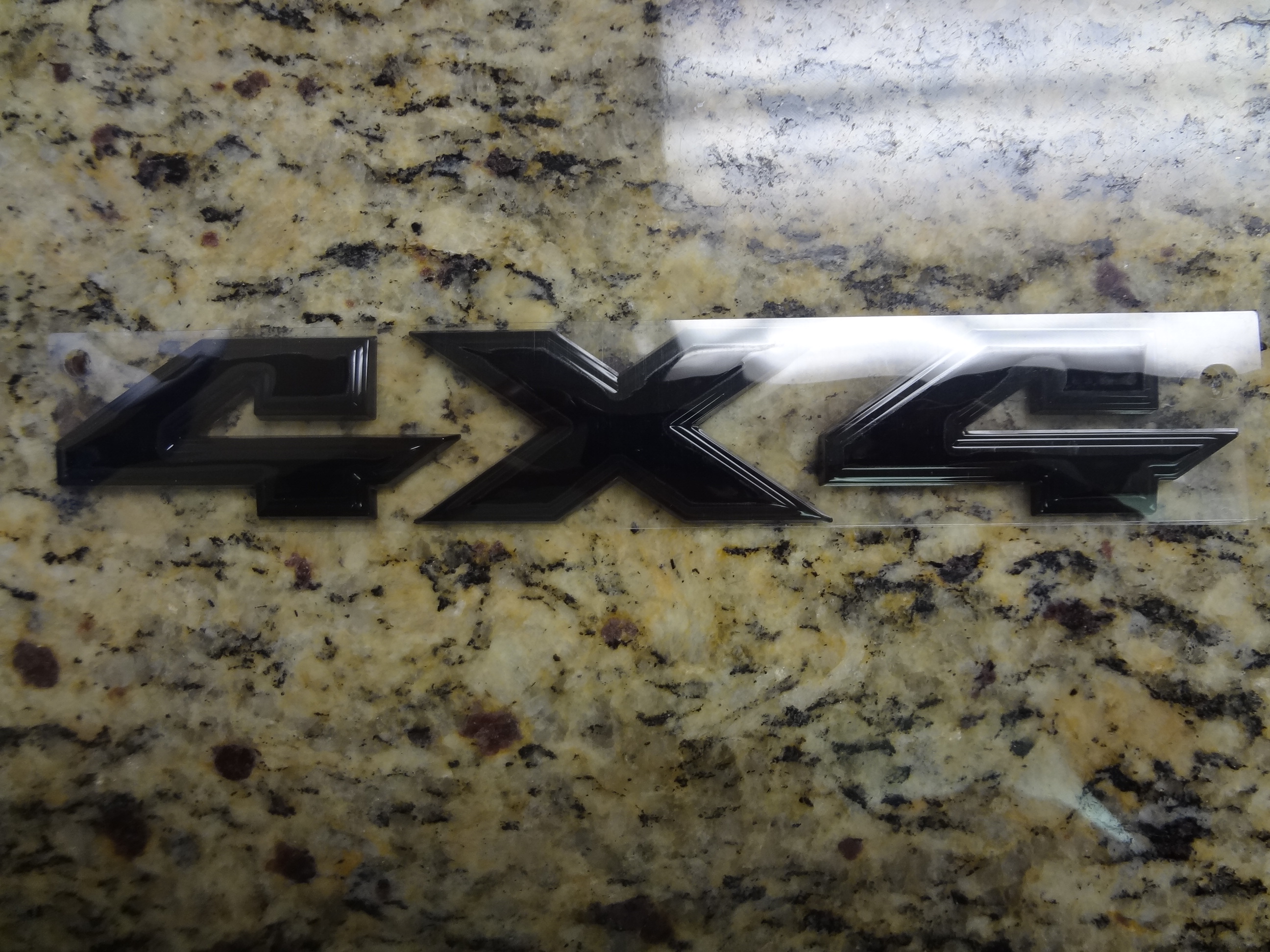 68219055AA - Exterior Ornamentation: Tailgate Nameplate for Ram: 1500, 2500, 3500 Image