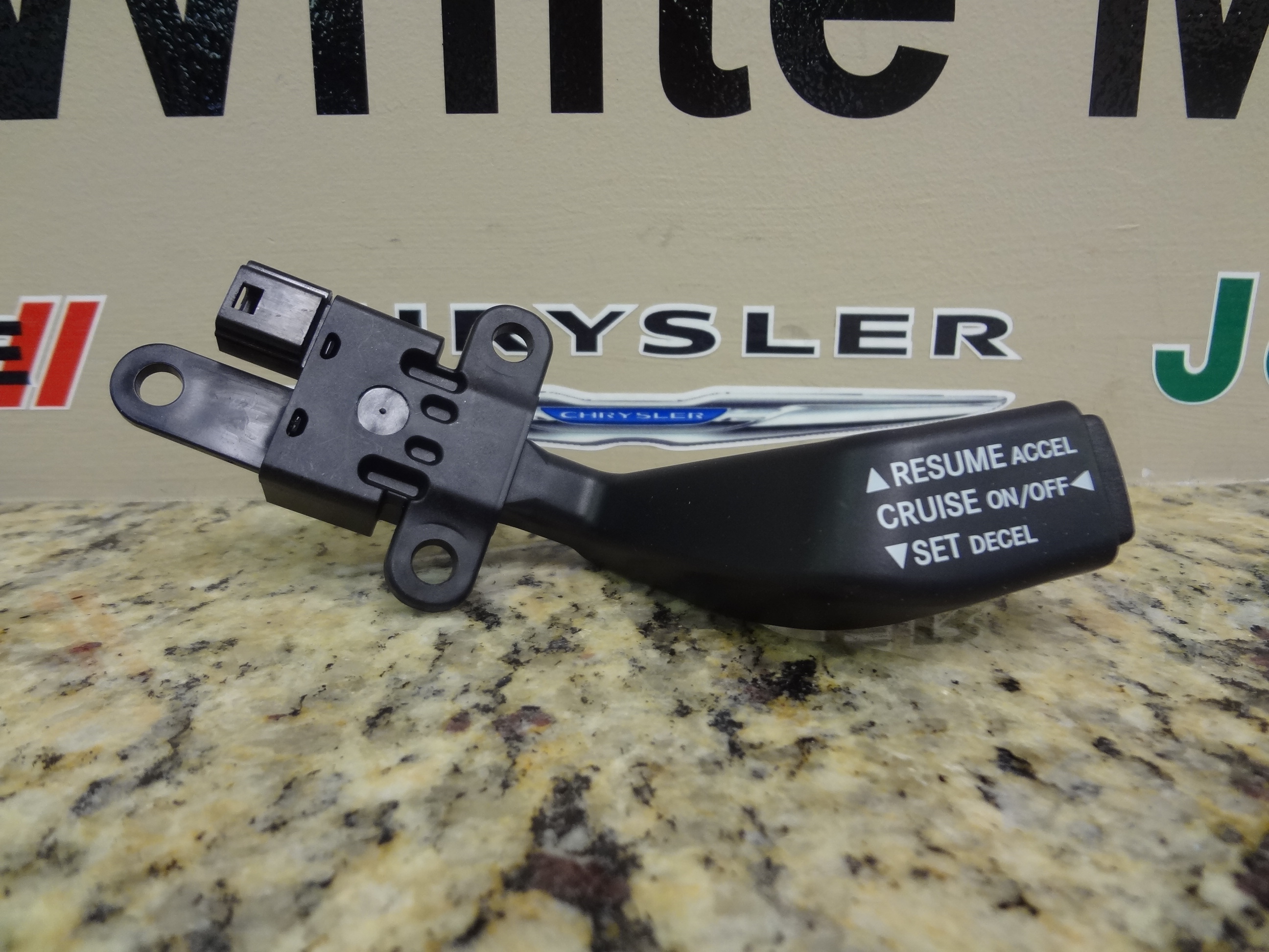 4671929AC - Electrical: Speed Control Switch for Chrysler: 200, PT Cruiser, Sebring, Town &amp; Country | Dodge: Avenger, Caliber, Grand Caravan, Journey, Nitro, Ram 1500, Ram 2500, Ram 3500 | Jeep: Commander, Compass, Grand Cherokee, Liberty, Patriot, Wrangler | Ram: 1500, 2500, 3500 Image