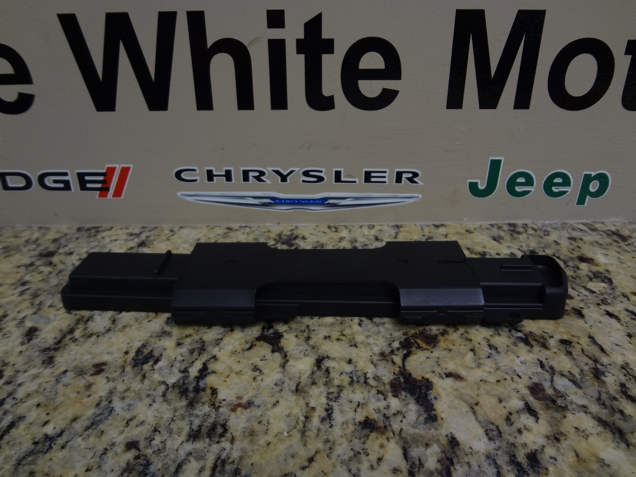 4885463AA - Air Conditioning &amp; Heater: Filter Access Door for Chrysler: Pacifica, Town &amp; Country, Voyager | Dodge: Caravan, Grand Caravan Image