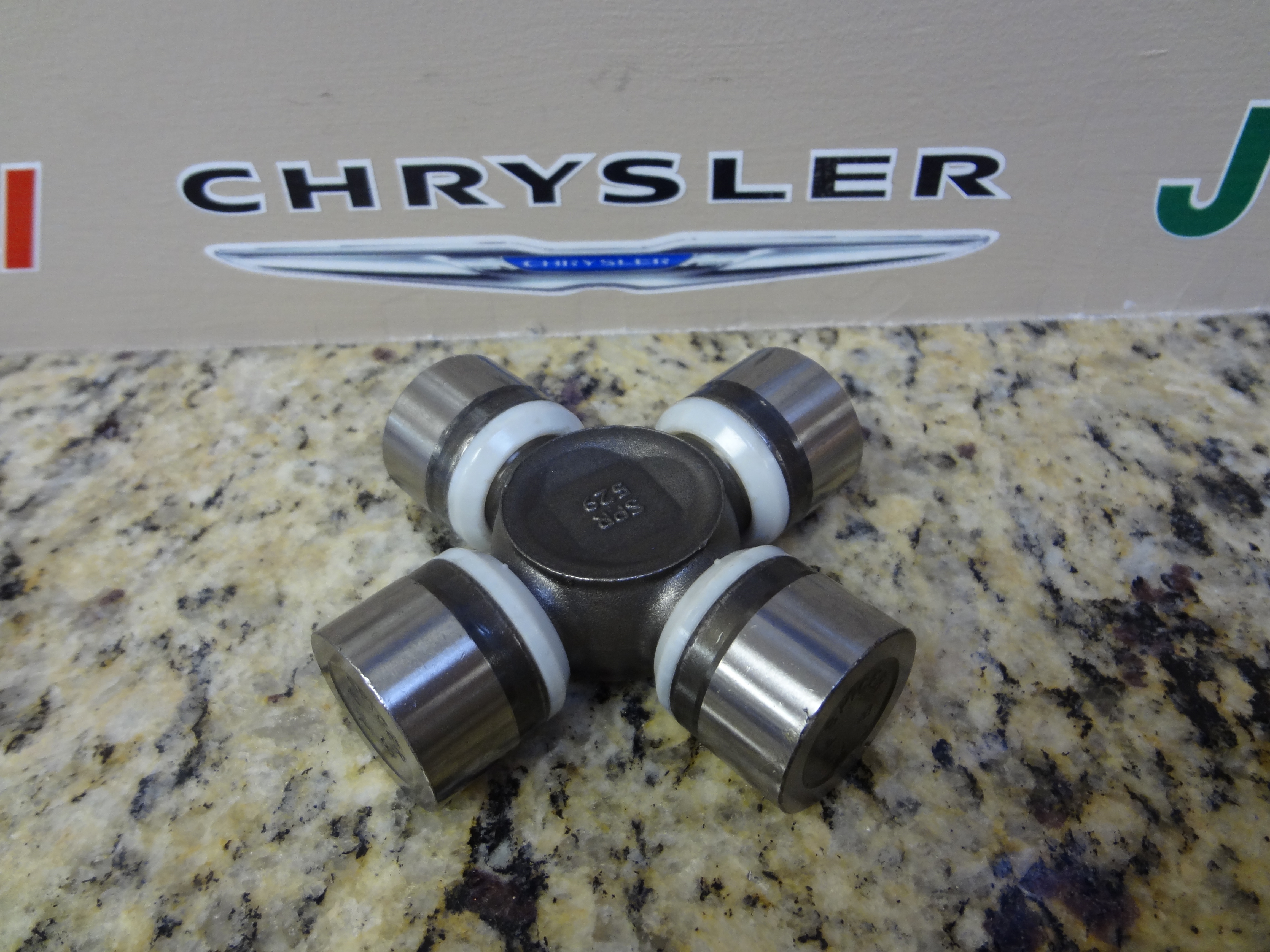 5015694AB - Propeller Shafts and U-Joints: U-joint Kit for Chrysler: Aspen | Dodge: Dakota, Durango | Jeep: Cherokee, Grand Cherokee, Liberty, Wrangler | Ram: Dakota Image