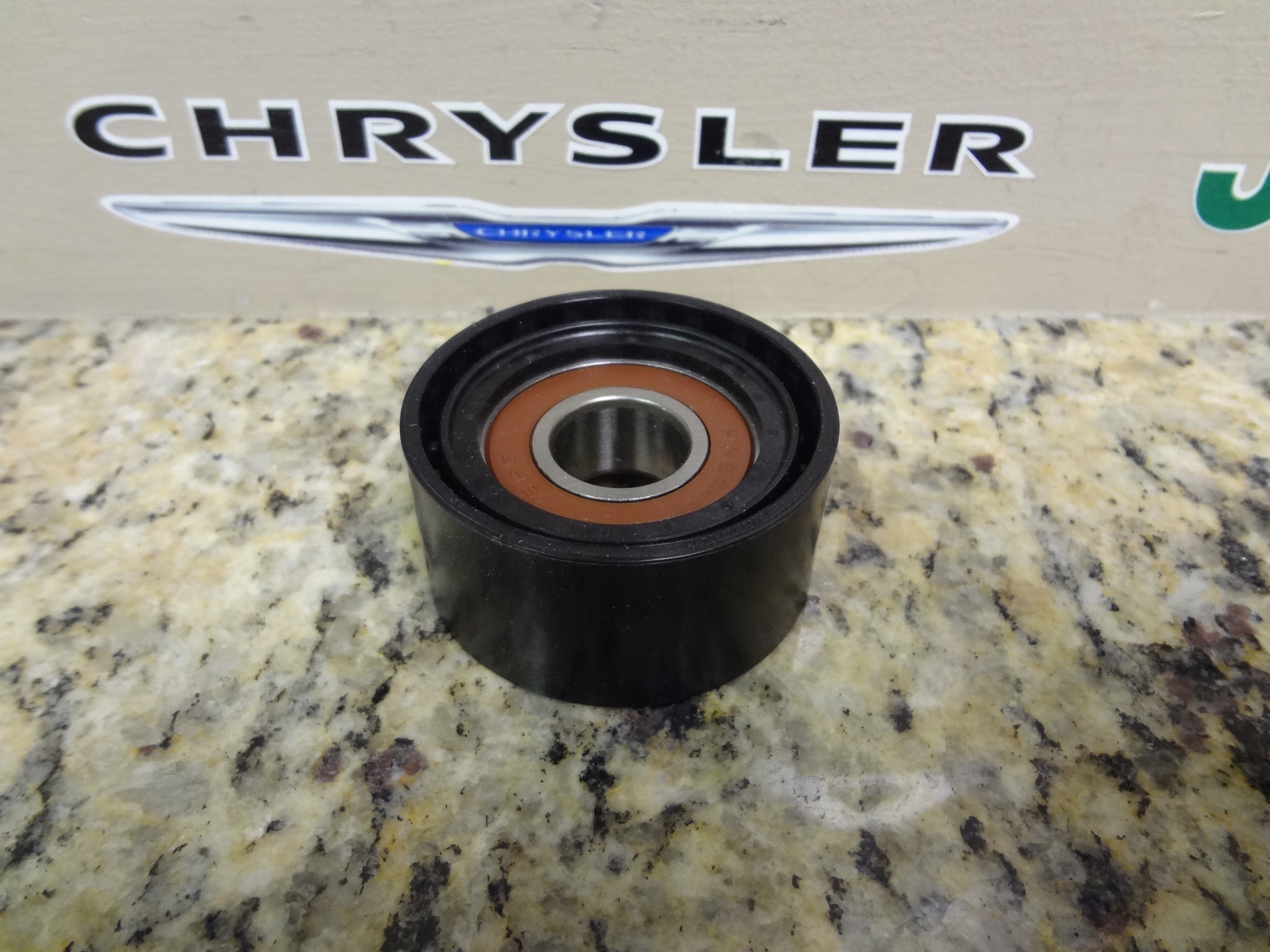 5080319AA - Cooling: Tensioner Pulley for Mopar Image