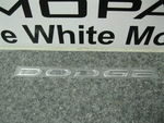 5113300AA - Exterior Ornamentation: Dodge Nameplate for Chrysler: 300M, Concorde, Sebring, Town &amp; Country, Voyager | Dodge: Caravan, Grand Caravan, Intrepid, Neon, Stratus Image