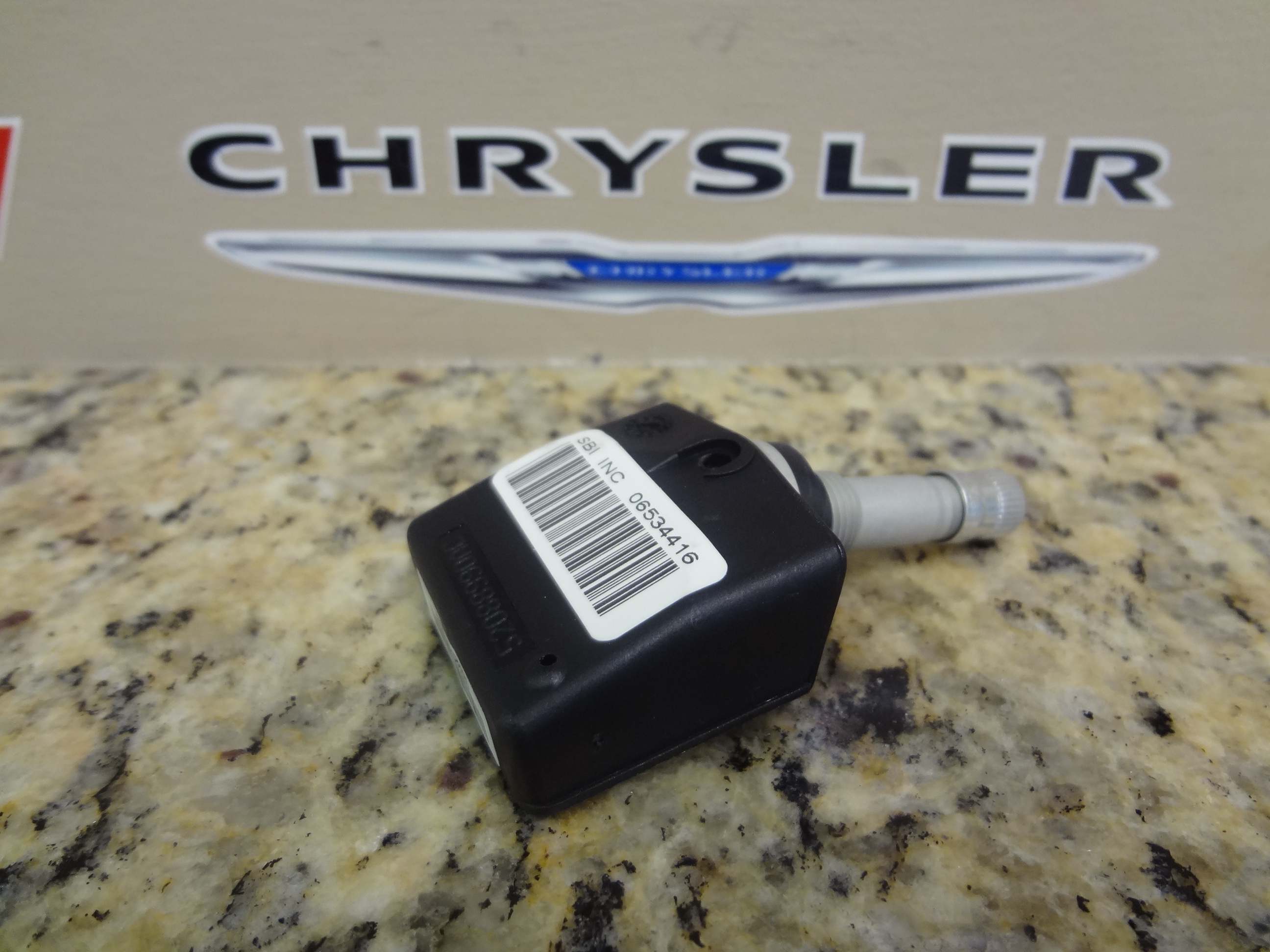 68406527AA - : Tire Pressure Sensor for Chrysler: 300M, Concorde, Crossfire, Pacifica, Town &amp; Country, Voyager | Dodge: Caravan, Grand Caravan, Intrepid, Viper | Jeep: Grand Cherokee, Liberty Image