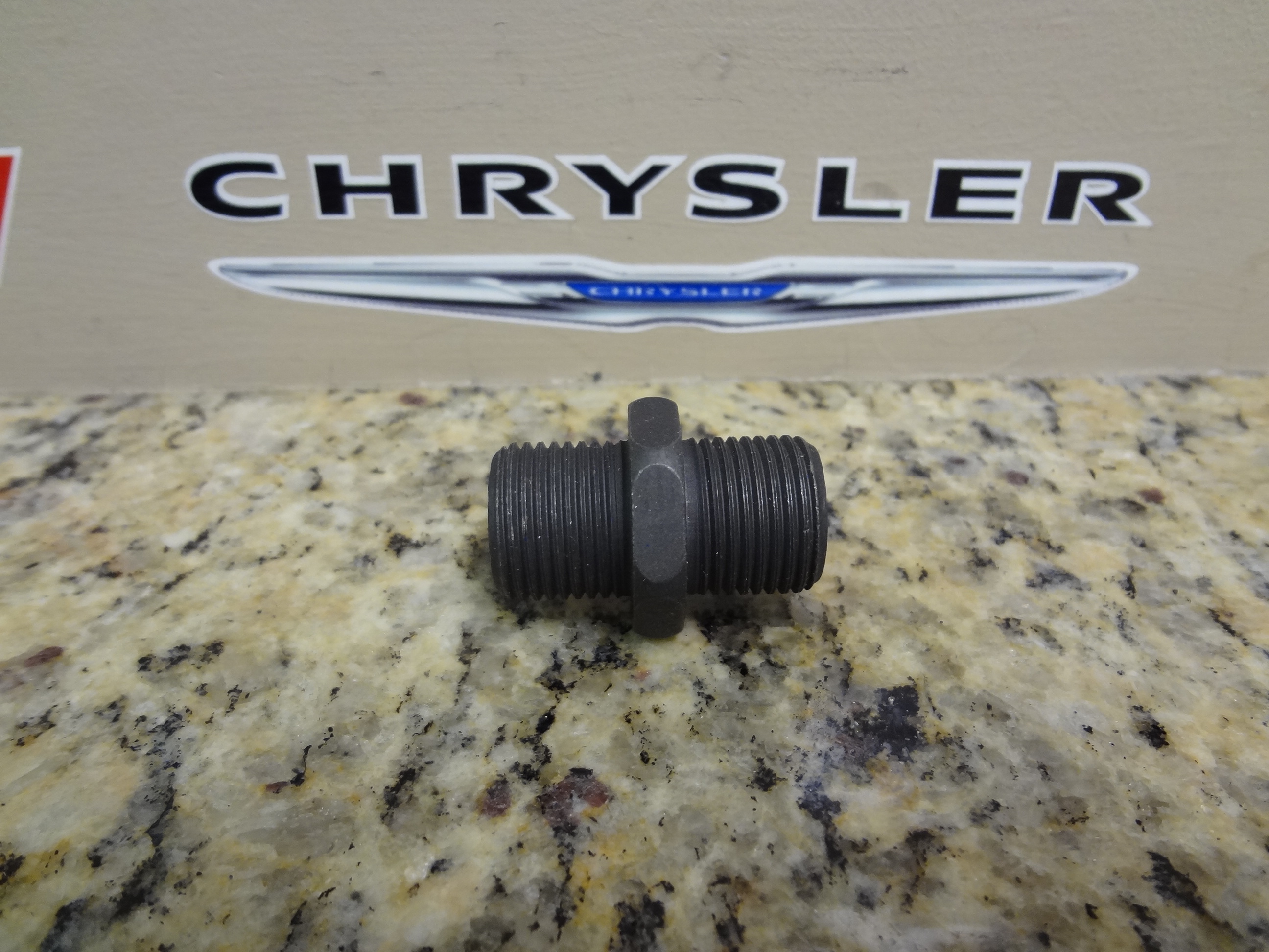 53007563AB - Engine 3.8L Six Cylinder: Oil Filter Connector for Chrysler: 300M, Aspen, Concorde, Pacifica, Sebring, Town &amp; Country, Voyager | Dodge: Caravan, Dakota, Durango, Grand Caravan, Intrepid, Nitro, Ram 1500, Ram 2500, Ram 3500, Stratus, Viper | Jeep: Cherokee, Commander, Grand Cherokee, Liberty, Wrangler Image