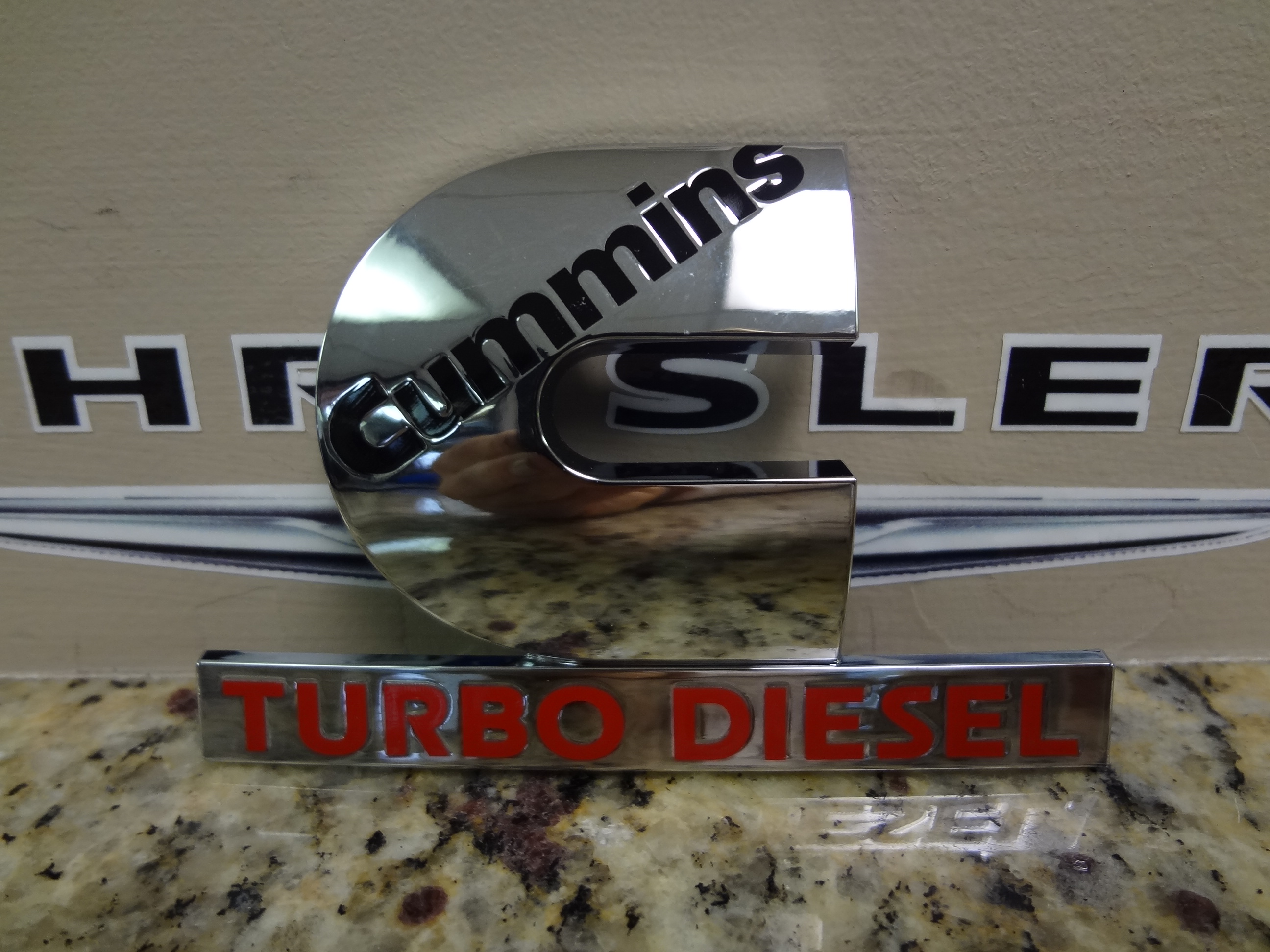 55077329AB - Exterior Ornamentation: Nameplate for Mopar Image