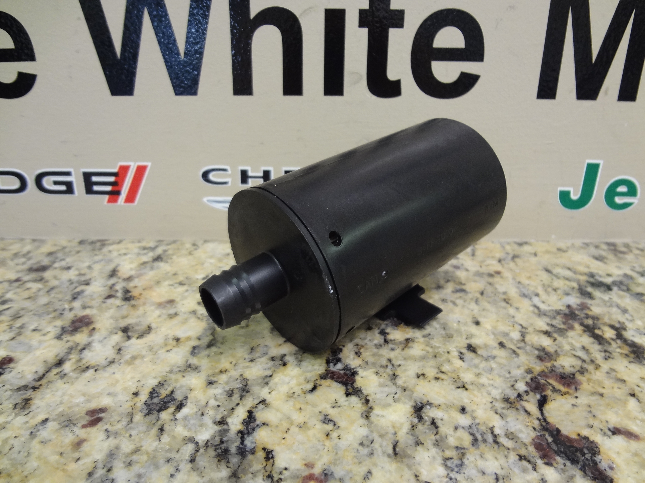 68012168AA - : Leak Detection Pump Filter for Dodge: Caliber, Journey | Jeep: Compass, Patriot, Wrangler Image