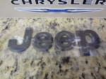 68207203AB - : 2014 JEEP CHEROKEE RAISED DECAL EMBLEM NAMEPLATE MINERAL GRAY MOPAR GENUINE OEM for Jeep: Cherokee Image