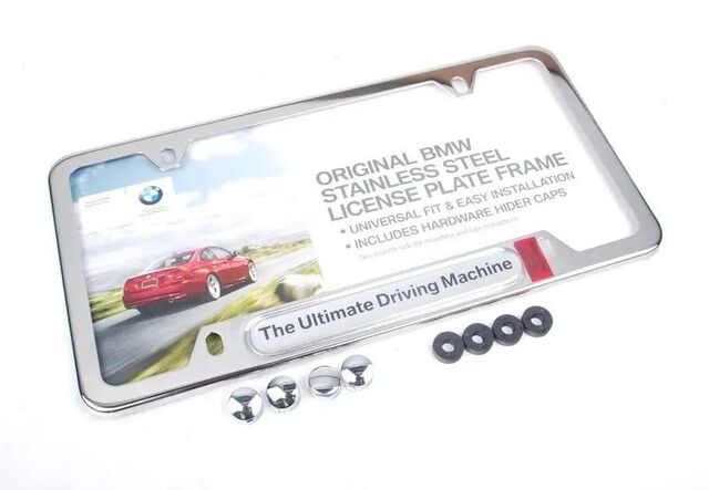 82112210416 - Exterior: License Plate Frame, Ultimate Driving Machine for BMW: 128i, 135i, 135is, 228i, 228i xDrive, 230i, 230i xDrive, 320i, 320i xDrive, 328d, 328d xDrive, 328i, 328i xDrive, 330e, 330i, 330i GT xDrive, 330i xDrive, 335i, 335i GT xDrive, 335i xDrive, 335is, 340i, 340i GT xDrive, 340i xDrive, 428i, 428i xDrive, 430i, 430i xDrive, 435i, 435i xDrive, 440i, 440i xDrive, 528i, 528i xDrive, 530i, 530i xDrive, 535d, 535d xDrive, 535i, 535i xDrive, 540d xDrive, 540i, 540i xDrive, 550i, 550i xDrive, 640i, 640i Gran Coupe, 640i xDrive, 640i xDrive Gran Coupe, 640i xDrive Gran Turismo, 650i, 650i Gran Coupe, 650i xDrive, 650i xDrive Gran Coupe, 740i, 740i xDrive, 740Li, 740Li xDrive, 750i, 750i xDrive, 750Li, 750Li xDrive, 760Li, 840i, Alpina B6 xDrive Gran Coupe, Alpina B7, M2, M235i, M235i xDrive, M240i, M240i xDrive, M3, M340i, M4, M5, M550i xDrive, M6, M6 Gran Coupe, M760i xDrive, M8, X1, X2, X3, X4, X5, X6, X7, Z4 Image