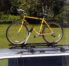 12497223 - Cargo Management: Roof Bicycle Carrier for Buick: Century, LeSabre, Park Avenue, Rainier, Regal, Rendezvous | Cadillac: CTS, DeVille, Eldorado, Escalade, Escalade ESV, Escalade EXT, SRX | Chevrolet: Astro, Blazer, Cavalier, Impala, Malibu, Prizm, Suburban 1500, Suburban 2500, Suburban C1500, Suburban C2500, Suburban K1500, Suburban K2500, Tahoe, Tracker, Trailblazer, Trailblazer EXT, Venture | GMC: Envoy, Envoy XL, Jimmy, Safari, Yukon, Yukon XL 1500, Yukon XL 2500 Image