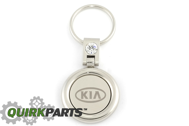 UM090AY705 - Keychain: Key Chain, Round Shape for Kia: Amanti, Borrego, Cadenza, Carnival, Forte, Forte Koup, Forte5, K5, K900, Niro, Niro EV, Optima, Rio, Rio5, Rondo, Sedona, Seltos, Sorento, Soul, Soul EV, Spectra, Spectra5, Sportage, Stinger, Telluride Image