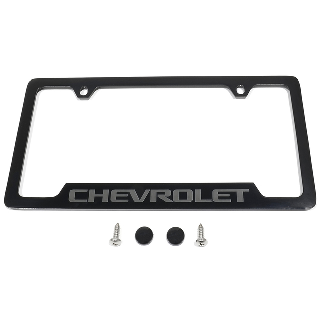 19330391 - Exterior: OEM NEW 15-20 GM Chevrolet Colorado License Plate Frame Chevrolet Black 19330391 for Cadillac: Escalade ESV | Chevrolet: Blazer, Blazer EV, Camaro, Colorado, Corvette, Cruze, Cruze Limited, Equinox, Equinox EV, Express 1500, Express 2500, Express 3500, Express 4500, Impala, Malibu, Silverado 1500, Silverado 1500 LD, Silverado 1500 LTD, Silverado 2500 HD, Silverado 3500 HD, Silverado EV, Sonic, Spark, Spark EV, SS, Suburban, Suburban 1500, Suburban 3500 HD, Tahoe, Trailblazer, Traverse, Trax, Volt Image