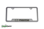 83Z32 - Exterior: License Plate Frame - Brushed with Mazda logo for Mazda: 2, 3, 5, 6, CX-3, CX-5, CX-7, CX-9, MPV, MX-5 Miata, RX-8, Tribute Image