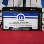 82213252AB - : License Plate Frame for Jeep: Cherokee, Compass, Gladiator, Grand Cherokee, Grand Cherokee L, Grand Cherokee WK, Grand Wagoneer, Grand Wagoneer L, Patriot, Renegade, Wagoneer, Wagoneer L, Wrangler Image