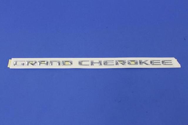68110321AC - Exterior Ornamentation: Front Door Nameplate, Right Or Left for Jeep: Grand Cherokee Image
