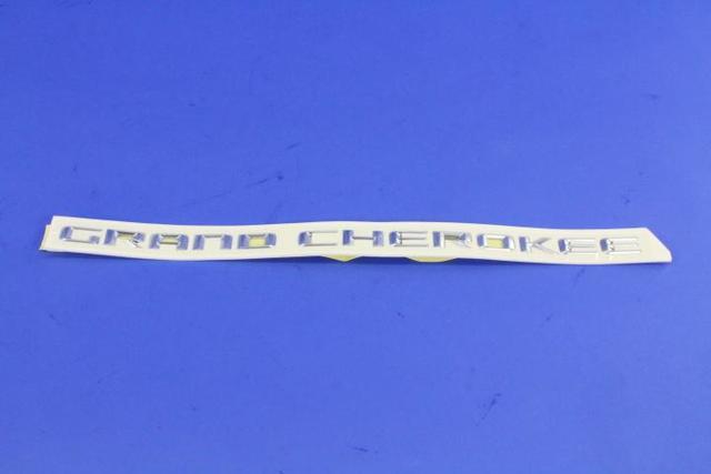 68236146AA - Exterior Ornamentation: Front Door Nameplate for Mopar Image