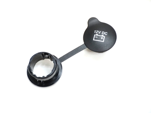 68049806AA - Interior Trim: Power Outlet Cap for Dodge: Durango, Ram 1500, Ram 2500, Ram 3500 | Jeep: Commander, Grand Cherokee, Grand Cherokee WK, Wrangler, Wrangler JK | Ram: 1500, 2500, 3500 Image