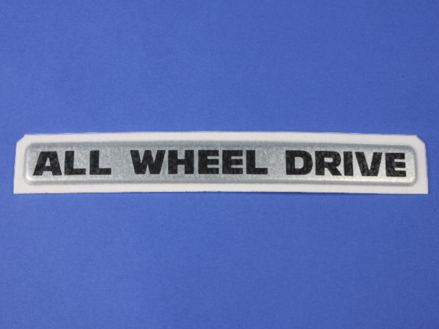 4857723AA - Exterior Ornamentation: All Wheel Drive Nameplate for Mopar Image