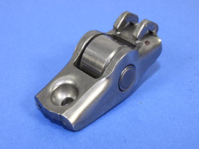 4884042AA - Engine 2.4L Four Cylinder: Valve Roller Rocker Arm for Chrysler: PT Cruiser, Sebring, Voyager | Dodge: Caravan, Neon, Stratus | Jeep: Liberty, Wrangler Image