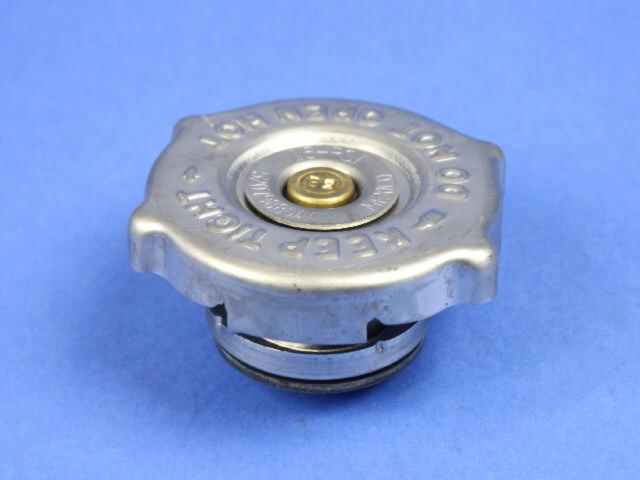 52079880AA - Cooling: Radiator Cap for Chrysler: Town &amp; Country, Voyager | Dodge: Caravan, Grand Caravan | Jeep: Cherokee | Ram: C/V Image