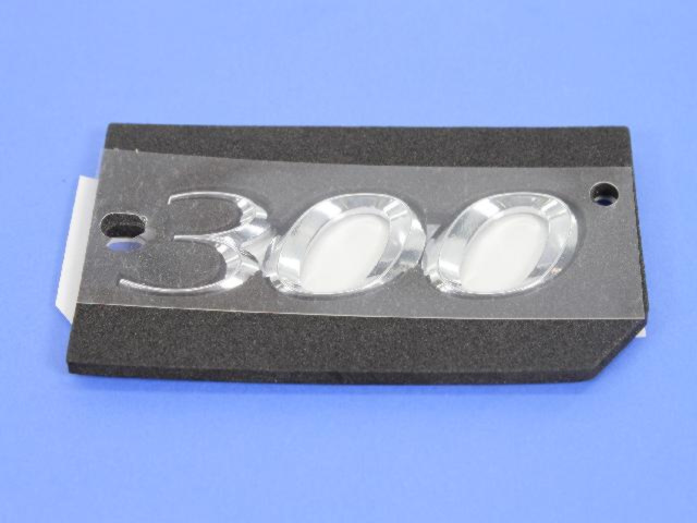 68087300AB - Exterior Ornamentation: Nameplate for Mopar Image