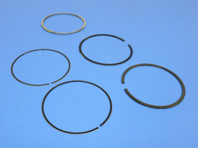 4897035AB - Engine 3.5L Six Cylinder: Complete Engine Piston Ring Set for Chrysler: 300, 300M, Concorde, Pacifica, Sebring, Town &amp; Country | Dodge: Avenger, Challenger, Charger, Grand Caravan, Intrepid, Journey, Magnum, Nitro Image