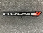 68227437AA - Exterior Ornamentation: Dodge Nameplate, Left for Mopar Image
