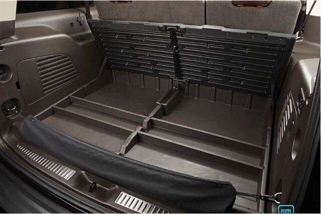 23477233 - Interior: 2015-2020 GM - Cargo Organizer - Yukon Xl - Kona Brown for Cadillac: Escalade, Escalade ESV | Chevrolet: Suburban, Suburban 3500 HD | GMC: Yukon, Yukon XL Image