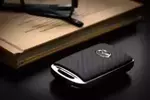 C9N1V0450 - Security: Key Fob Cover - Carbon Fiber for Mazda: 3, CX-30, CX-5, CX-50, CX-70, CX-9, CX-90, MX-30 EV Image