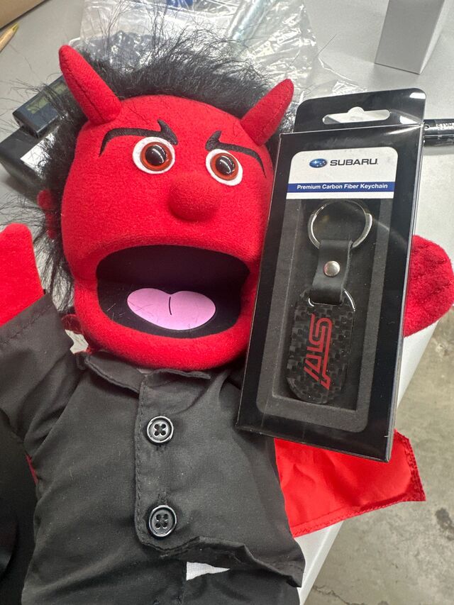 SOA342L156 - Miscellaneous: Carbon Fiber Key Fob - Sti Logo for Subaru: BRZ, Crosstrek, Forester, Impreza, Legacy, Outback, WRX Image