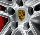 4460711 - : Colored Porsche Crest center caps for the 20-inch Macan Sport ​Design wheel silver for Porsche Image