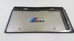 82121470398 - Exterior: M Logo Marque Plate for BMW: 128i, 135i, 135is, 228i, 228i xDrive, 230i, 230i xDrive, 320i, 320i xDrive, 328d, 328d xDrive, 328i, 328i xDrive, 330e, 330i, 330i GT xDrive, 330i xDrive, 335i, 335i GT xDrive, 335i xDrive, 335is, 340i, 340i GT xDrive, 340i xDrive, 428i, 428i xDrive, 430i, 430i xDrive, 435i, 435i xDrive, 440i, 440i xDrive, 528i, 528i xDrive, 530i, 530i xDrive, 535d, 535d xDrive, 535i, 535i GT, 535i GT xDrive, 535i xDrive, 540d xDrive, 540i, 540i xDrive, 550i, 550i GT xDrive, 550i xDrive, 640i, 640i Gran Coupe, 640i xDrive, 640i xDrive Gran Coupe, 640i xDrive Gran Turismo, 650i, 650i Gran Coupe, 650i xDrive, 650i xDrive Gran Coupe, 740e xDrive, 740i, 740i xDrive, 740Li, 740Li xDrive, 750i, 750i xDrive, 750Li, 750Li xDrive, 760Li, 840i, Alpina B6 xDrive Gran Coupe, Alpina B7, M2, M235i, M235i xDrive, M240i, M240i xDrive, M3, M340i, M4, M5, M550i xDrive, M6, M6 Gran Coupe, M760i xDrive, M8, X1, X2, X3, X4, X5, X6, X7, Z4 Image